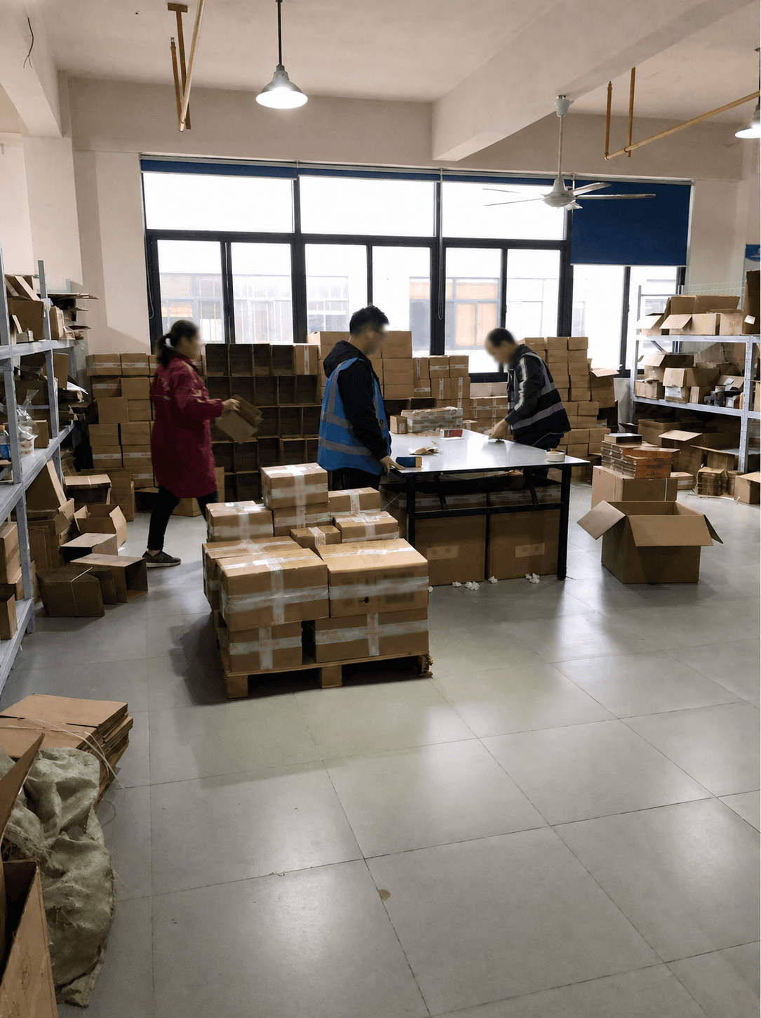 Warehouse team preparing and checking orders